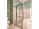 Walk-in shower with glass enclosure and grab bar at 10232 Grant Creek Dr, Tampa, FL 33647