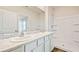 Bathroom with double vanity, white cabinets, and a shower/tub combo at 10264 Kalamazoo Pl, Parrish, FL 34219
