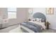 bedroom with a gray headboard, playful decor, and window at 10264 Kalamazoo Pl, Parrish, FL 34219