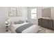 Bedroom with neutral decor and plenty of natural light at 10264 Kalamazoo Pl, Parrish, FL 34219