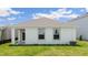 Single story home with covered patio and landscaped yard at 10264 Kalamazoo Pl, Parrish, FL 34219