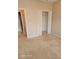 Bedroom with double-door closet and carpet flooring at 1028 Tullamore Dr, Wesley Chapel, FL 33543