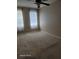 Well-lit bedroom featuring neutral walls and carpet at 1028 Tullamore Dr, Wesley Chapel, FL 33543