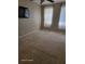Spacious bedroom with wall-mounted TV and large windows at 1028 Tullamore Dr, Wesley Chapel, FL 33543