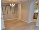 Bright dining room featuring hardwood floors and a chandelier at 1028 Tullamore Dr, Wesley Chapel, FL 33543