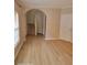 Light-filled entryway with stairs and wood-look floors at 1028 Tullamore Dr, Wesley Chapel, FL 33543