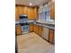 Kitchen with wood cabinets, stainless steel appliances at 1028 Tullamore Dr, Wesley Chapel, FL 33543
