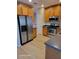 Kitchen with wood cabinets and stainless steel appliances at 1028 Tullamore Dr, Wesley Chapel, FL 33543