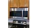 Modern Samsung microwave above the stovetop at 1028 Tullamore Dr, Wesley Chapel, FL 33543