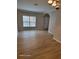 Spacious living room with large window and hardwood floors at 1028 Tullamore Dr, Wesley Chapel, FL 33543