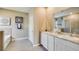 Elegant bathroom with double vanity, soaking tub, and separate shower at 10818 Patoka Ter, Parrish, FL 34219