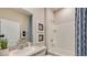 Clean bathroom with a single vanity, tub, and shower combo at 10822 Patoka Ter, Parrish, FL 34219