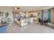 Living room with a white sofa, blue accents, and a wood accent wall at 10822 Patoka Ter, Parrish, FL 34219