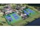 Aerial view of community pickleball courts near water at 12661 Lily Quartz Loop, Parrish, FL 34219