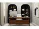 Bright home office features built-in shelving and a large desk at 12661 Lily Quartz Loop, Parrish, FL 34219