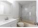 Updated bathroom with white vanity and bathtub at 13907 Fletchers Mill Dr, Tampa, FL 33613