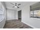 Spacious bedroom with window, ceiling fan and gray flooring at 1421 Normandy Park Dr # 2, Clearwater, FL 33756