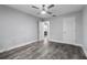 Well lit bedroom with ceiling fan and an ensuite bathroom at 1421 Normandy Park Dr # 2, Clearwater, FL 33756