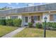 Charming condo exterior with a well-maintained lawn at 1421 Normandy Park Dr # 2, Clearwater, FL 33756
