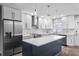 Modern kitchen with white cabinets, a large island, and stainless steel appliances at 1421 Normandy Park Dr # 2, Clearwater, FL 33756