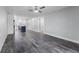 Bright living room featuring wood-look floors and ceiling fan at 1421 Normandy Park Dr # 2, Clearwater, FL 33756