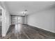 Bright living room featuring barn doors and gray toned laminate flooring at 1421 Normandy Park Dr # 2, Clearwater, FL 33756