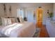 King-size bed, ensuite bathroom access, and plenty of natural light at 1433 Pine Glen Pl # G2, Tarpon Springs, FL 34688