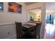 Small breakfast nook with table and two chairs at 1433 Pine Glen Pl # G2, Tarpon Springs, FL 34688