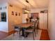 Dining room with wood table, chairs, and modern lighting at 1433 Pine Glen Pl # G2, Tarpon Springs, FL 34688
