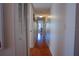Light and bright hallway with wood flooring at 1433 Pine Glen Pl # G2, Tarpon Springs, FL 34688