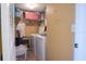 Laundry room with washer, dryer, and shelving at 1433 Pine Glen Pl # G2, Tarpon Springs, FL 34688