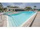 Refreshing pool and hot tub with surrounding patio at 1433 Pine Glen Pl # G2, Tarpon Springs, FL 34688