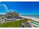 Aerial view of beachfront condo building with ocean and pool views at 1460 Gulf Blvd # 811, Clearwater Beach, FL 33767