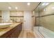Spa-like bathroom featuring a soaking tub, double vanity, and frameless shower at 1460 Gulf Blvd # 811, Clearwater Beach, FL 33767