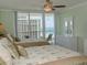 Bedroom with two beds and balcony access with ocean view at 1460 Gulf Blvd # 811, Clearwater Beach, FL 33767