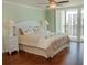King size bed and calming decor in the bedroom at 1460 Gulf Blvd # 811, Clearwater Beach, FL 33767
