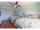 Guest bedroom with two twin beds, wood floors, and plenty of closet space at 1460 Gulf Blvd # 811, Clearwater Beach, FL 33767