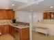Updated kitchen with wood cabinets and stainless steel appliances at 1460 Gulf Blvd # 811, Clearwater Beach, FL 33767