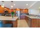 Stylish kitchen with island, stainless steel appliances, and wood cabinets at 1460 Gulf Blvd # 811, Clearwater Beach, FL 33767