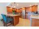 Modern kitchen with island, stainless steel appliances, and wood cabinets at 1460 Gulf Blvd # 811, Clearwater Beach, FL 33767