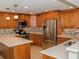 Updated kitchen, stainless steel appliances, light wood cabinets, and quartz countertops at 1460 Gulf Blvd # 811, Clearwater Beach, FL 33767