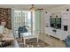 Spacious living room with ocean view, fireplace, and built-in entertainment center at 1460 Gulf Blvd # 811, Clearwater Beach, FL 33767