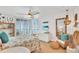 Bright bedroom with ocean view, ceiling fan, and coastal decor at 1520 Gulf Blvd # 603, Clearwater Beach, FL 33767
