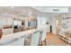 Modern white kitchen with stainless steel appliances at 1520 Gulf Blvd # 603, Clearwater Beach, FL 33767