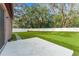 Landscaped backyard with patio and grassy area at 15571 Stone House Dr, Brooksville, FL 34604
