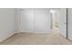 Spacious bedroom with a double door closet and access to a bathroom at 15571 Stone House Dr, Brooksville, FL 34604