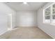 Bright bedroom featuring carpet flooring and access to bathroom at 15571 Stone House Dr, Brooksville, FL 34604
