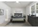 Bright bedroom with a queen-size bed and dresser at 15571 Stone House Dr, Brooksville, FL 34604