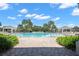 Resort-style pool with cabanas and lush landscaping at 15571 Stone House Dr, Brooksville, FL 34604
