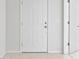 Interior entry with white door and tile flooring at 15571 Stone House Dr, Brooksville, FL 34604